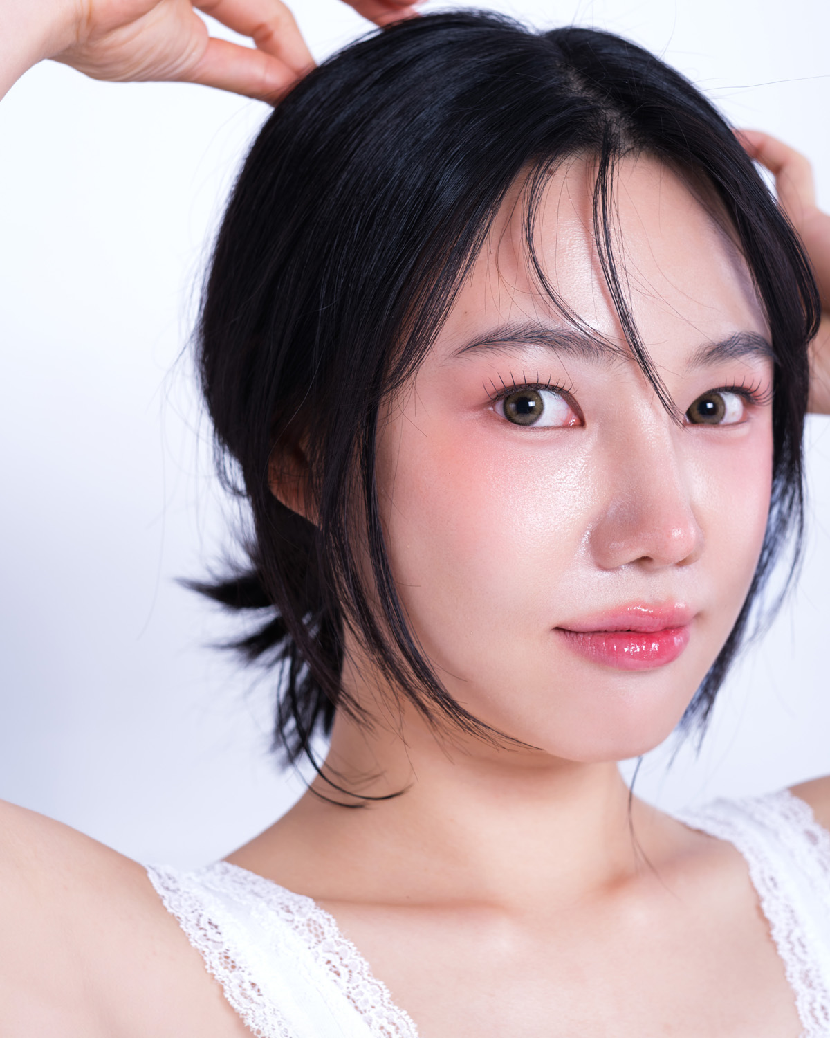Clean Girl — direct gaze, hands in hair